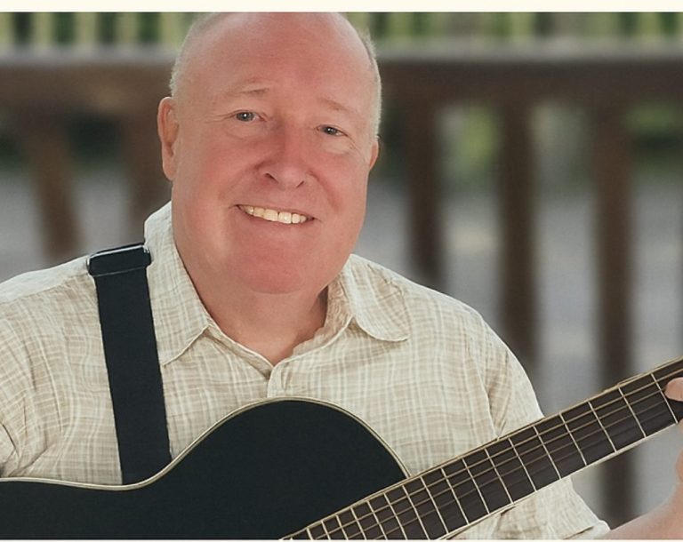 Tony Osborne preforming acoustically for a small audience